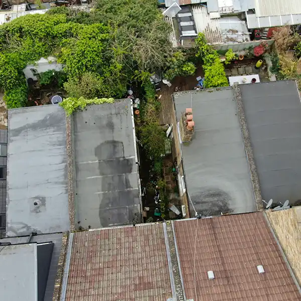 Chartered building surveyors carrying out a professional drone roof survey in London